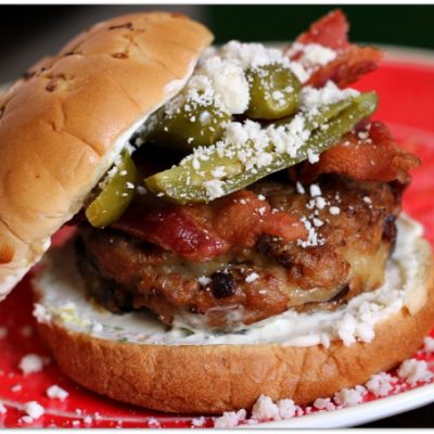 Cheese Stuffed Chipotle Pork Burgers Topped with Bacon and Jalapenos